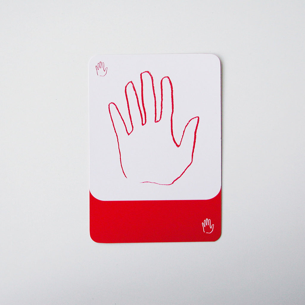 Eine Karte aus dem Kartenspiel Nomo zeigt eine Hand