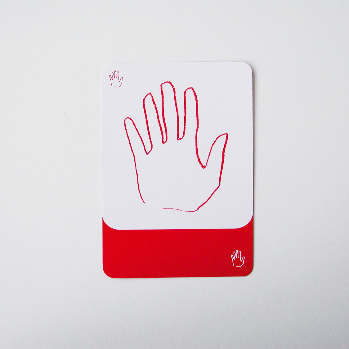 Eine Karte aus dem Kartenspiel Nomo zeigt eine Hand